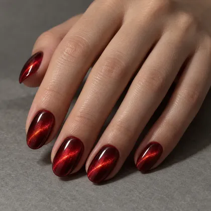 Generated example: hand with glossy deep red cat-eye nails and a band of shimmer